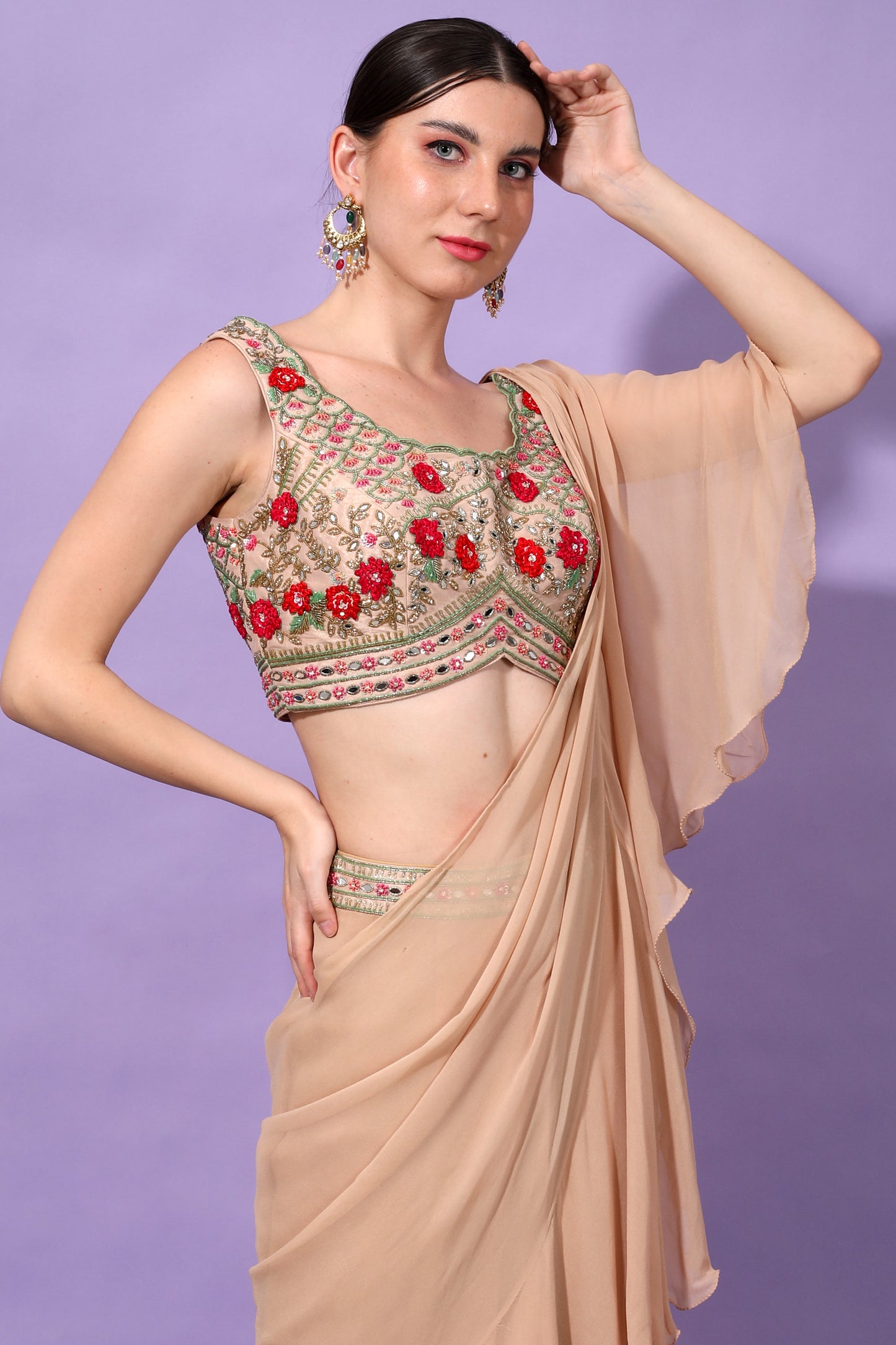 Pre draped saree with embroidered blouse.